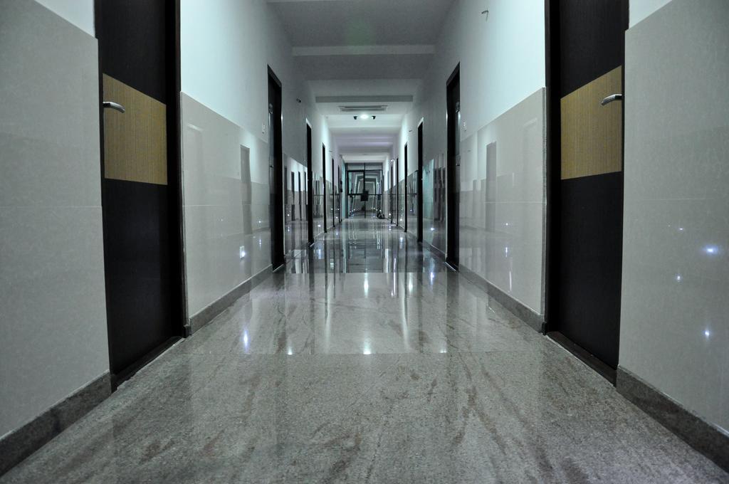 Hotel The Home Tiruppur Ruang foto